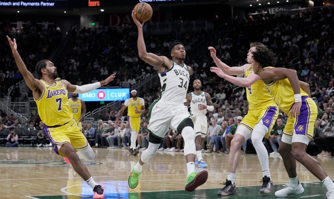 Milwaukee Bucks forward Giannis Antetokounmpo (34) drives to the basket for a dunk during the first half of their preseason game against the Los Angeles Lakers Thursday, October 10, 2024 at Fiserv Forum in Milwaukee, Wisconsin.