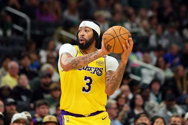 Lakers star Anthony Davis handles the ball during their preseason...