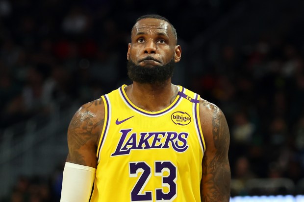 Lakers star LeBron James walks back down the court during...