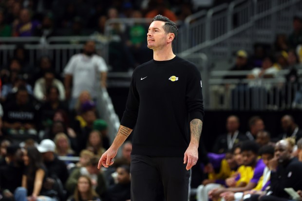 Lakers head coach JJ Redick reacts to an official’s call...