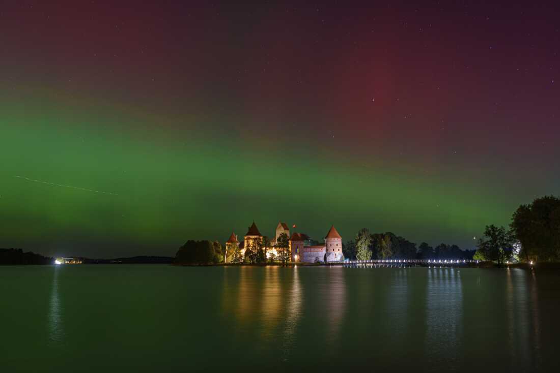 Northern lights shine in the night sky above Trakai castle, about 18 miles from Vilnius, Lithuania, on Oct. 10.