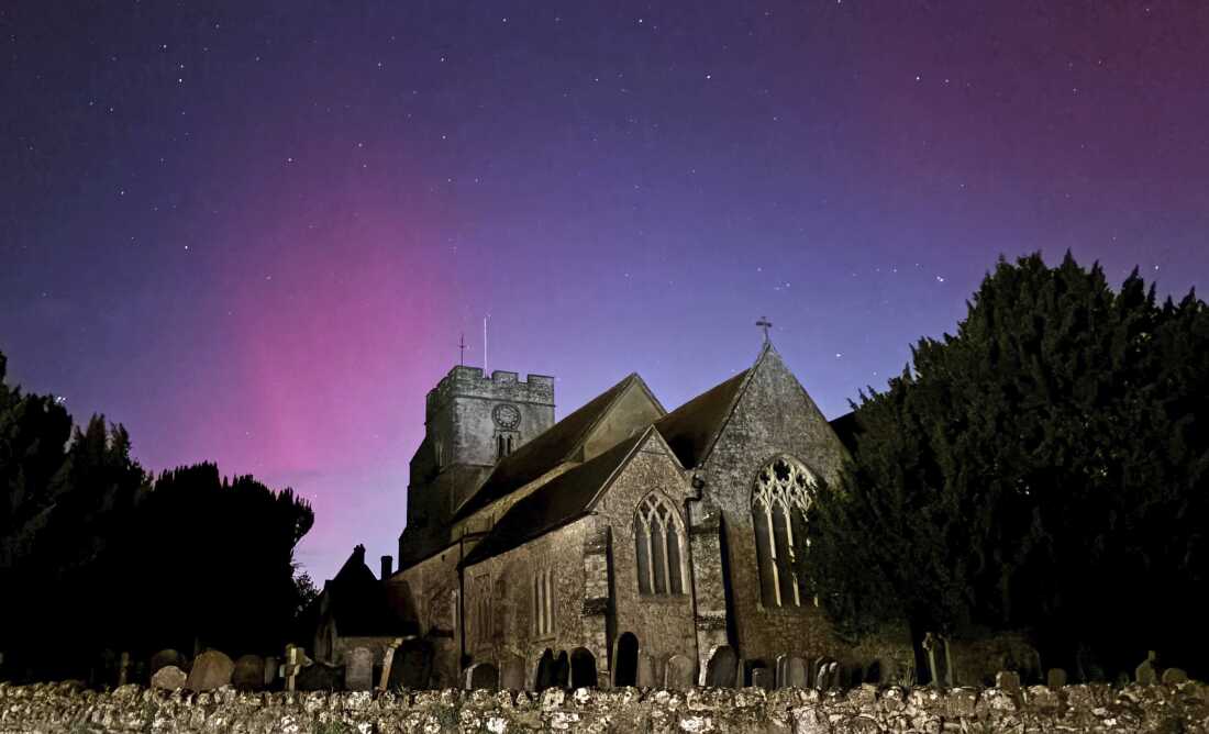 Northern lights on display in the skies over Great Chart Church, Ashford, Kent, England, on Oct. 10.