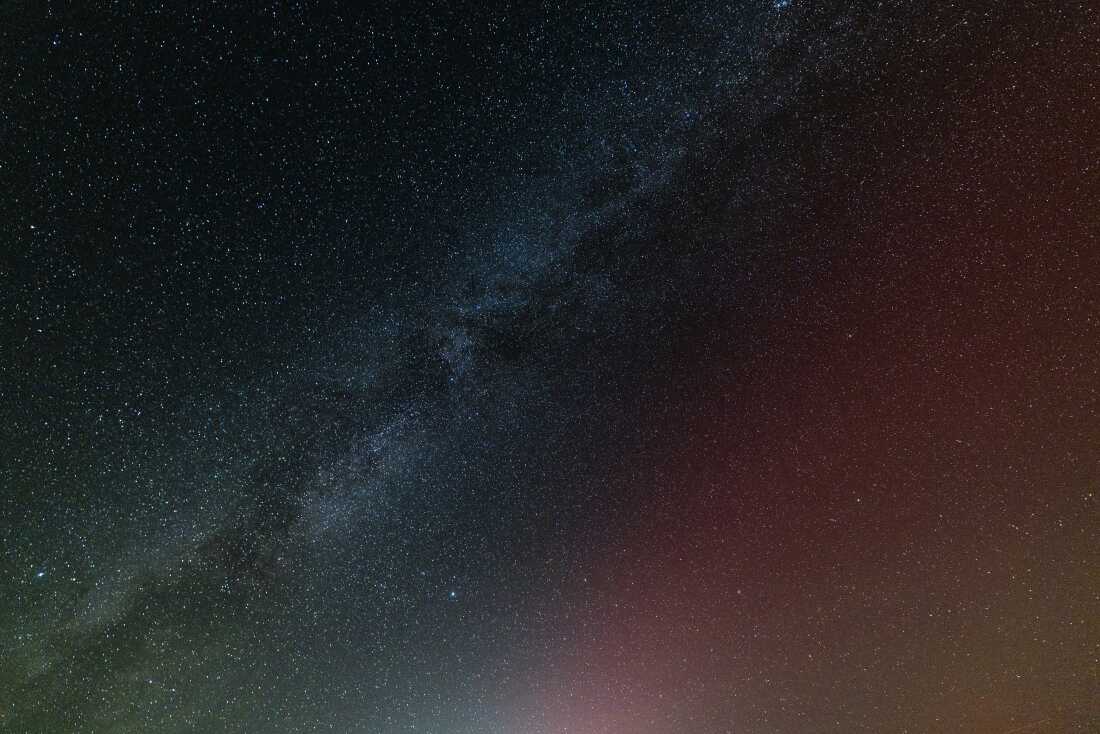 The Milky Way and northern lights are seen together as the aurora makes a rare appearance in the early morning hours of Oct. 8, southwest of Mammoth Lakes, California.