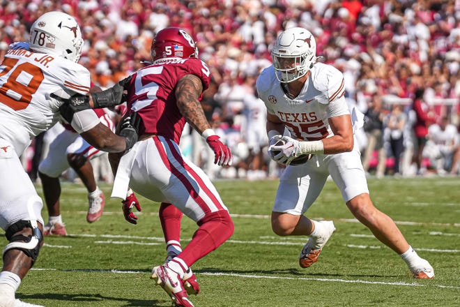 Texas tight end Gunnar Helm runs the ball into the end zone in the second quarter against Oklahoma Saturday in the Cotton Bowl in Dallas.