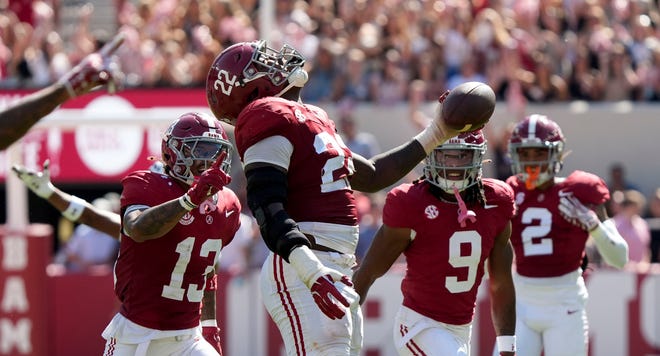 Oct 12, 2024; Tuscaloosa, Alabama, USA; Alabama Crimson Tide defensive lineman LT Overton (22) celebrates after recovering a South Carolina fumble at Bryant-Denny Stadium. Alabama defeated South Carolina 27-25. Mandatory Credit: Gary Cosby Jr.-Imagn Images