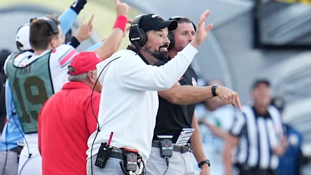 Ohio State Buckeyes head coach Ryan Day motions during the first half of the NCAA football game against the Oregon Ducks at A