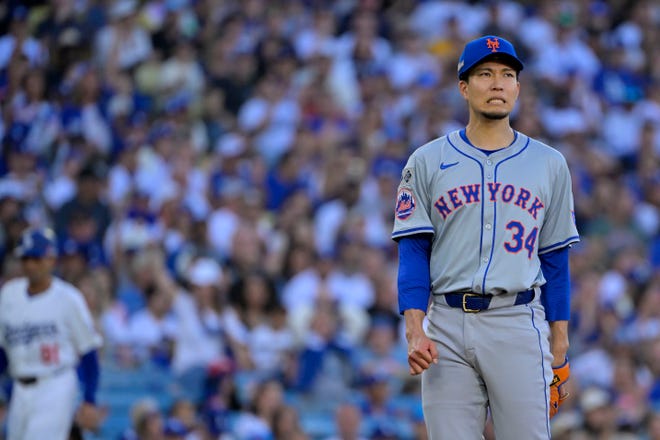 Oct 13, 2024; Los Angeles, California, USA; New York Mets pitcher Kodai Senga (34) reacts against the Los Angeles Dodgers during the first inning in game one of the NLCS for the 2024 MLB Playoffs at Dodger Stadium. Mandatory Credit: Jayne Kamin-Oncea-Imagn Images