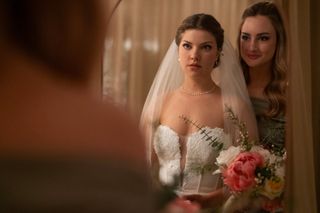 Catherine Missal as Grace, wearing a wedding dress and looking into the mirror as Grace Van Patten as Lucy looks over her shoulder, in 'Tell Me Lies' season 2