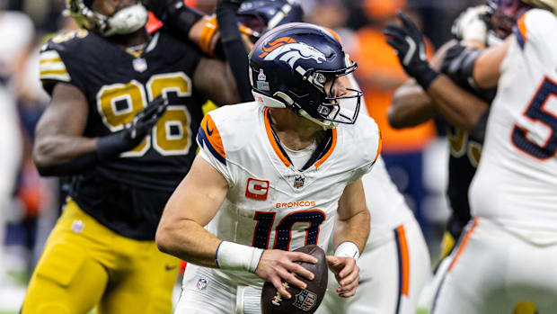 Oct 17, 2024; New Orleans, Louisiana, USA;  Denver Broncos quarterback Bo Nix (10) scrambles out the pocket against New Orlea