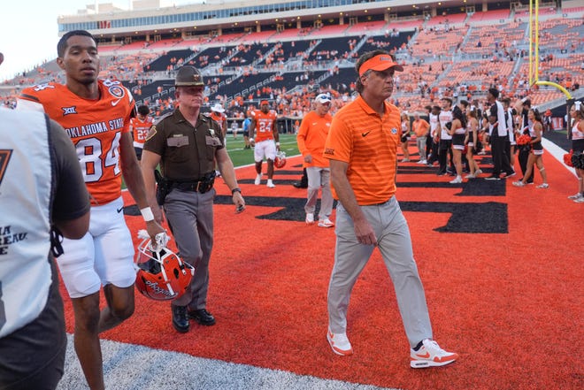 Oklahoma State coach Mike Gundy walks of the field after a college football game between the Oklahoma State Cowboys (OSU) and the West Virginia Mountaineers at Boone Pickens Stadium in Stillwater, Okla., Saturday, Oct. 5, 2024.