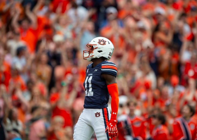 Auburn Tigers wide receiver Malcolm Simmons (11) celebrates his touchdown catch as Auburn Tigers take on Oklahoma Sooners at Jordan-Hare Stadium in Auburn, Ala., on Saturday, Sept. 28, 2024. Auburn Tigers lead Oklahoma Sooners 14-7 at halftime.