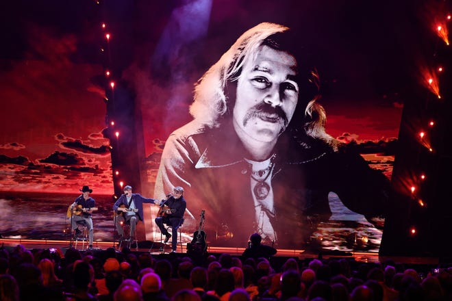 CLEVELAND, OHIO - OCTOBER 19: (L-R) Kenny Chesney, James Taylor and Mac McAnally perform onstage during the 2024 Rock & Roll Hall Of Fame Induction Ceremony streaming on Disney+ at Rocket Mortgage Fieldhouse on October 19, 2024 in Cleveland, Ohio. (Photo by Theo Wargo/Getty Images for The Rock and Roll Hall of Fame)