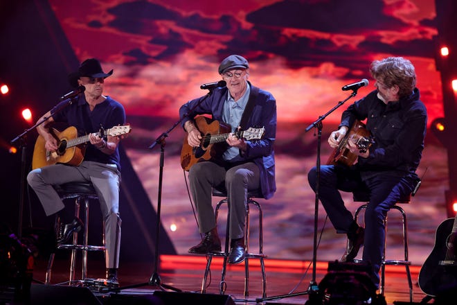 CLEVELAND, OHIO - OCTOBER 19: (L-R) Kenny Chesney, James Taylor and Mac McAnally perform onstage during the 2024 Rock & Roll Hall Of Fame Induction Ceremony streaming on Disney+ at Rocket Mortgage Fieldhouse on October 19, 2024 in Cleveland, Ohio. (Photo by Theo Wargo/Getty Images for The Rock and Roll Hall of Fame)