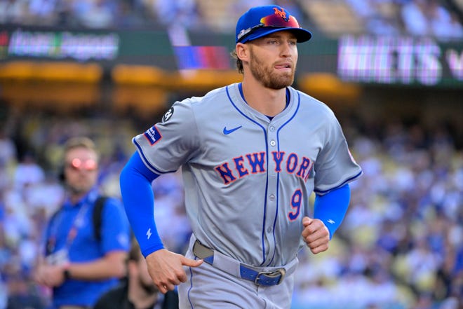 Oct 13, 2024; Los Angeles, California, USA; New York Mets outfielder Brandon Nimmo (9) takes the field before game one of the NLCS for the 2024 MLB Playoffs at Dodger Stadium. Mandatory Credit: Jayne Kamin-Oncea-Imagn Images