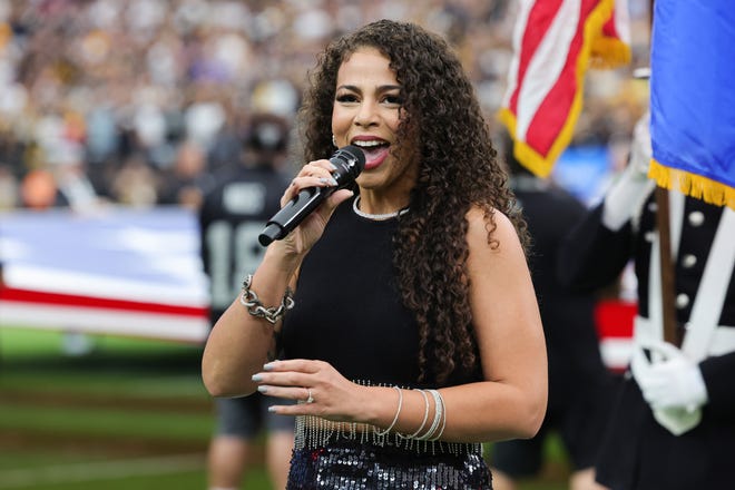 Musician and WWE ring announcer Samantha Irvin performs the United States national anthem before a game between the Pittsburgh Steelers and the Las Vegas Raiders at Allegiant Stadium on October 13, 2024 in Las Vegas, Nevada.