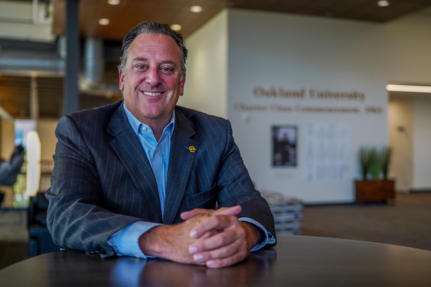 David Dulio sits at a desk.