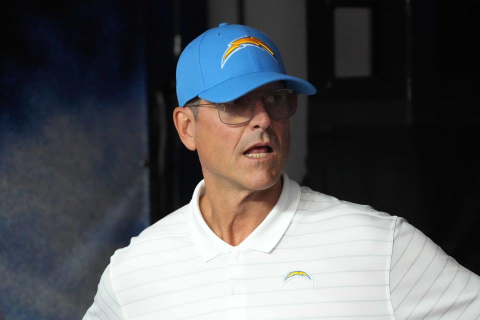 Sep 8, 2024; Inglewood, California, USA; Los Angeles Chargers coach Jim Harbaugh prepares to enter the field before the game against the Las Vegas Raiders at SoFi Stadium. Mandatory Credit: Kirby Lee-Imagn Images