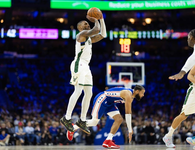 Bucks guard Damian Lillard hoists up a shot after getting 76ers forward Caleb Martin off-balance during the second quarter Wednesday night in Philadelphia.