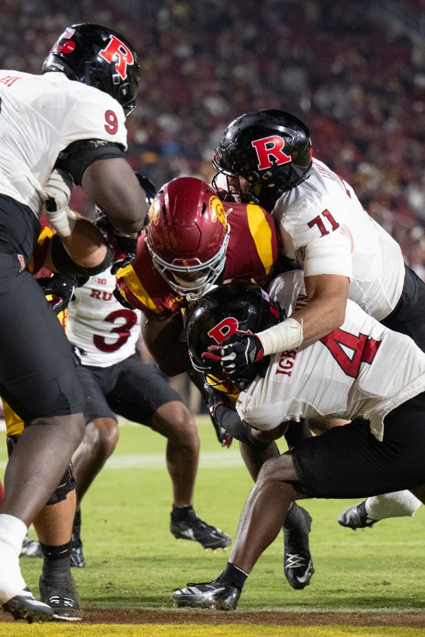 USC running back Woody Marks, center, scores a touchdown during...