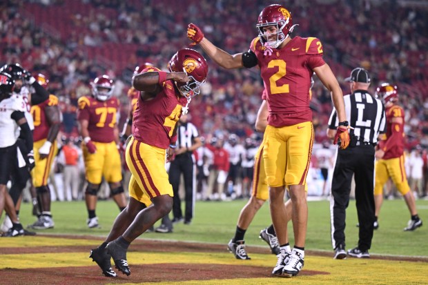 USC running back Woody Marks, left, and wide receiver Duce...