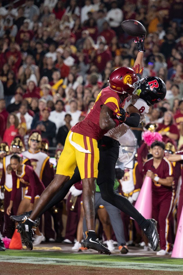 USC cornerback DeCarlos Nicholson, left, breaks up a pass intended...