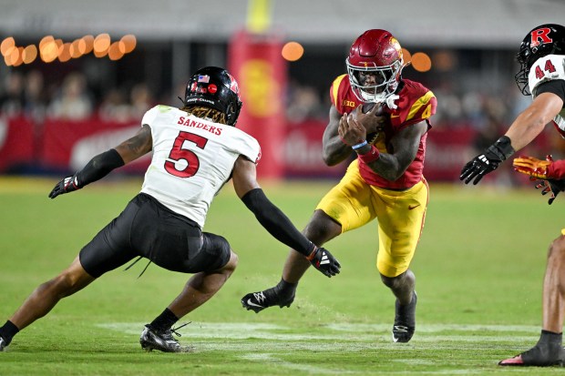 USC running back Woody Marks looks for a path past...