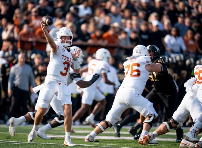 Texas Longhorns quarterback Quinn Ewers fires a pass against the Vanderbilt Commodores during the first half of a game Saturday at FirstBank Stadium in Nashville. Ewers had a big first half to help the Longhorns seize a halftime lead.