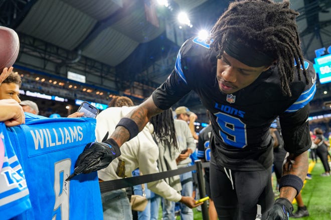 Detroit Lions wide receiver Jameson Williams (9) signs autographs during the pregame for the N.F.L. game between the Detroit Lions and the Seattle Seahawks at Ford Field in Detroit, Monday, Sept. 30, 2024.