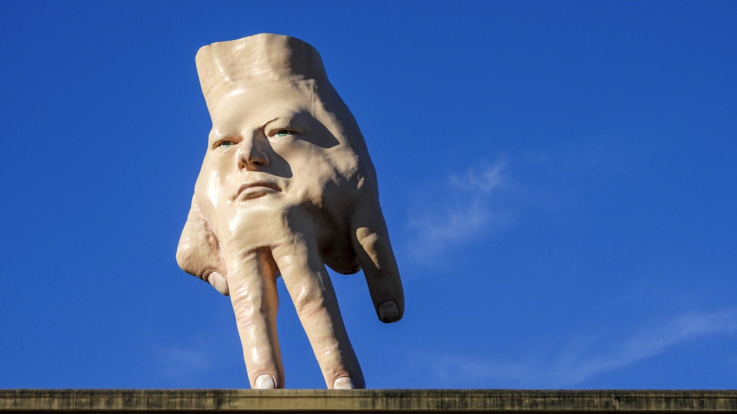 A New Zealand city waves goodbye to its giant hand sculpture that many came to love