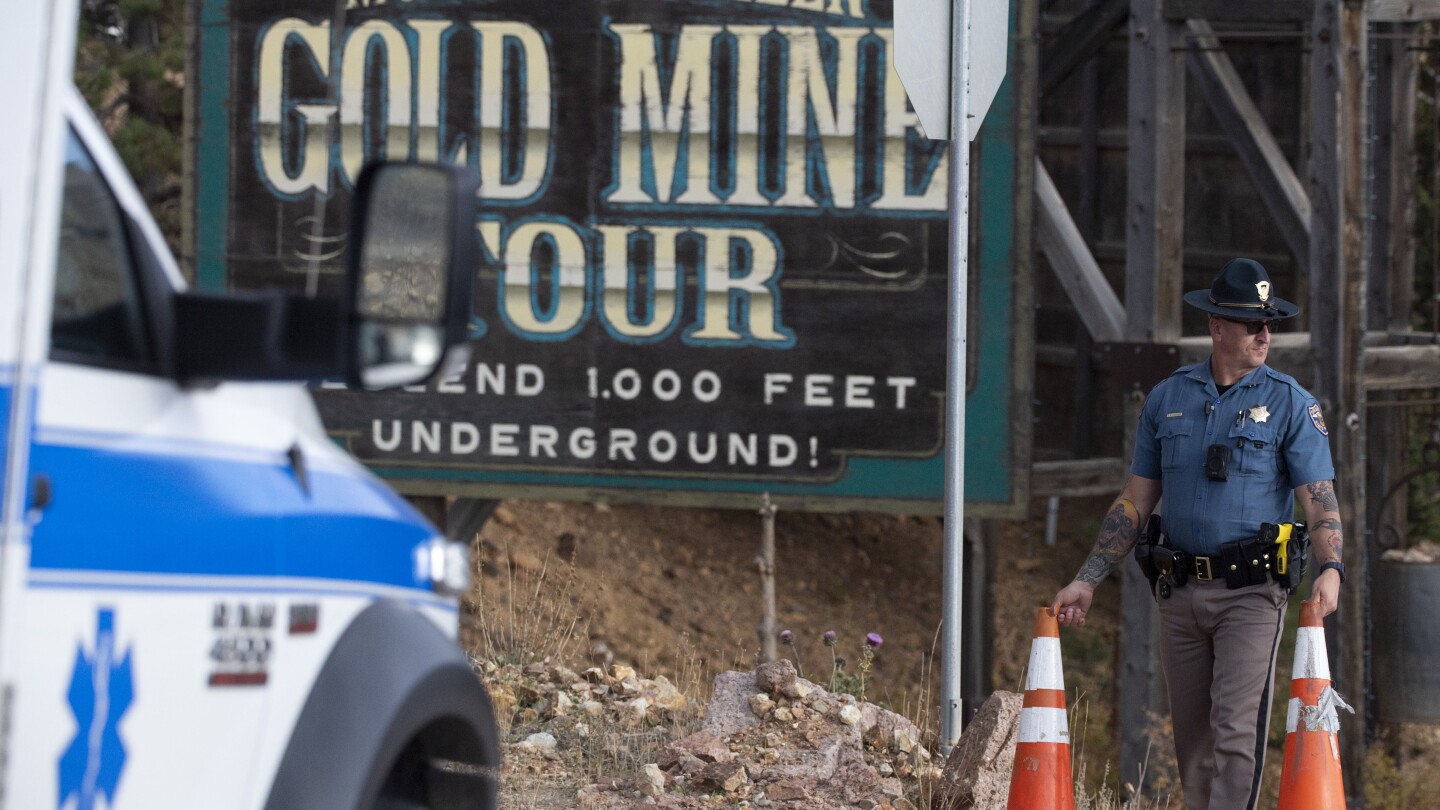 An elevator mishap at a Colorado tourist mine killed 1 and trapped 12. The cause is still unknown