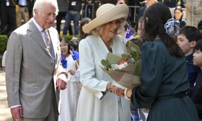 Children greet King Charles III and Queen Camilla outside a Sydney church