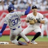 Anthony Volpe of the New York Yankees looks to complete a 2nd-inning double play after forcing out Teoscar Hernández of the Los Angeles Dodgers at Yankee Stadium on June 7 in New York City. 