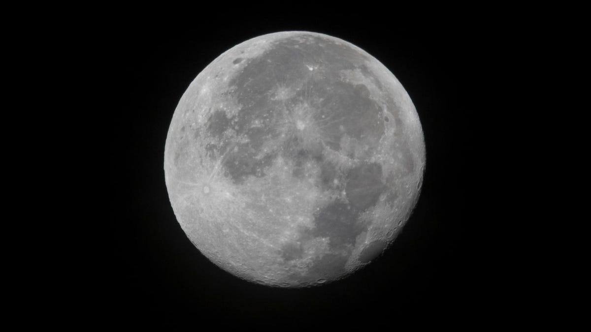 Full moon in detail against the darkness of space.