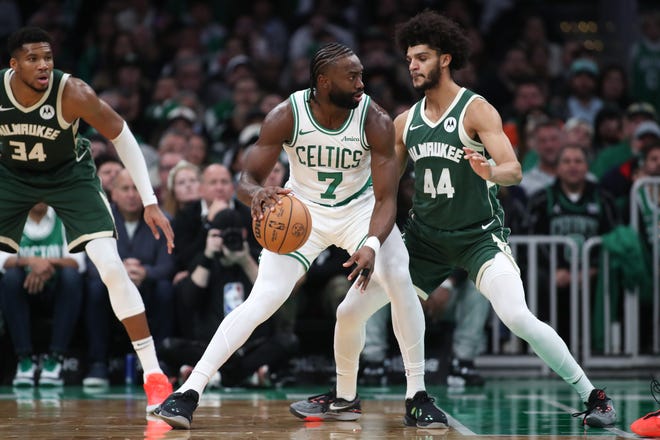 Oct 28, 2024; Boston, Massachusetts, USA; Boston Celtics forward Jaylen Brown (7) dribbles down the court defended by Milwaukee Bucks forward Andre Jackson Jr (44) during the first half at TD Garden. Mandatory Credit: Paul Rutherford-Imagn Images