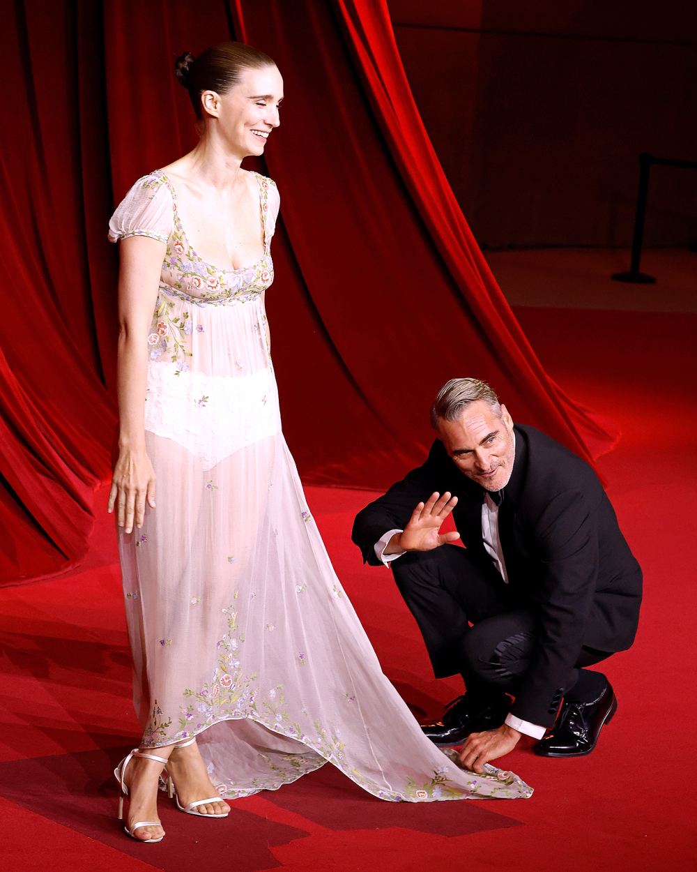 Joaquin Phoenix Adorably Fixes Pregnant Rooney Mara's Train at Academy Museum Gala