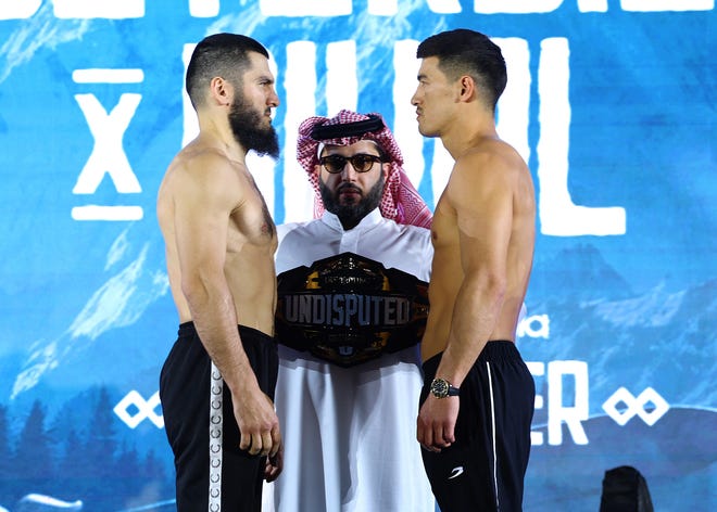 Artur Beterbiev and Dmitry Bivol face off after weigh-ins ahead of their undisputed light heavyweight title fight on Oct. 12.