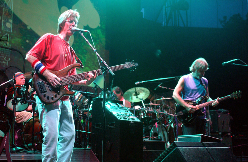 Former bassist for the Grateful Dead Phil Lesh (L) performs with surviving bandmates Bob Weir, (R) a..