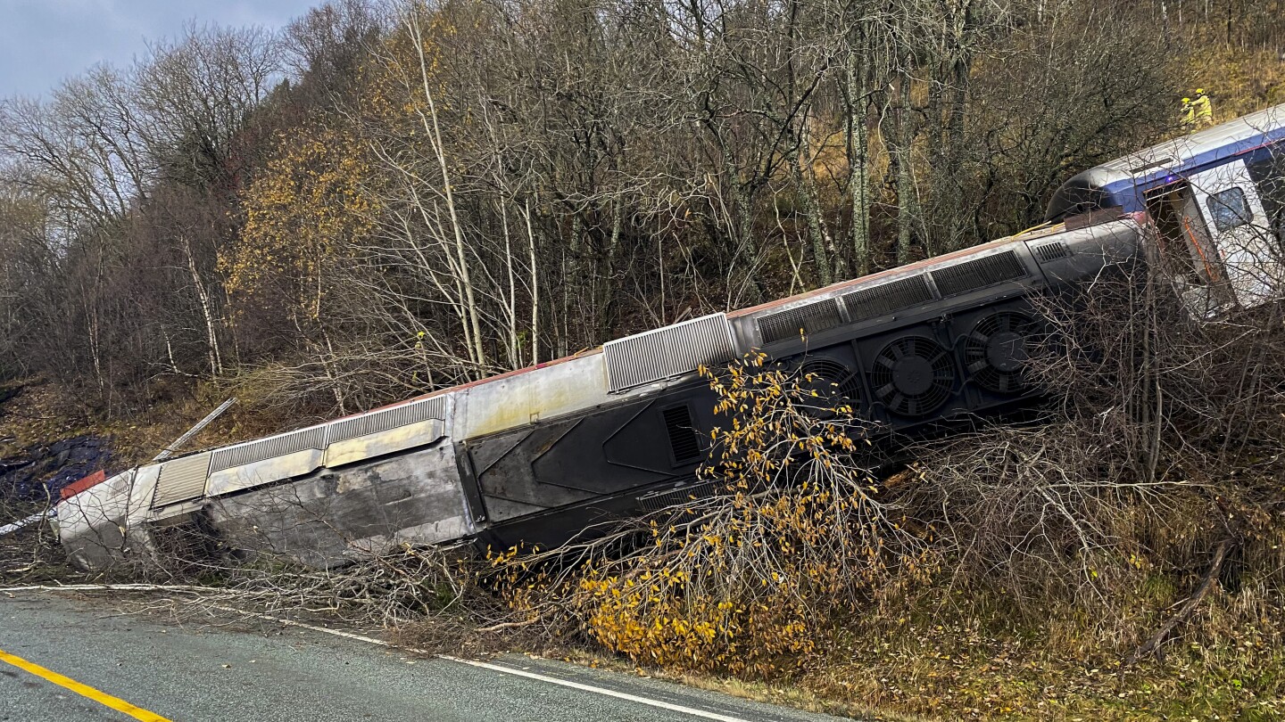 Train carrying at least 50 people derails on Norway's north coast, killing at least 1 person