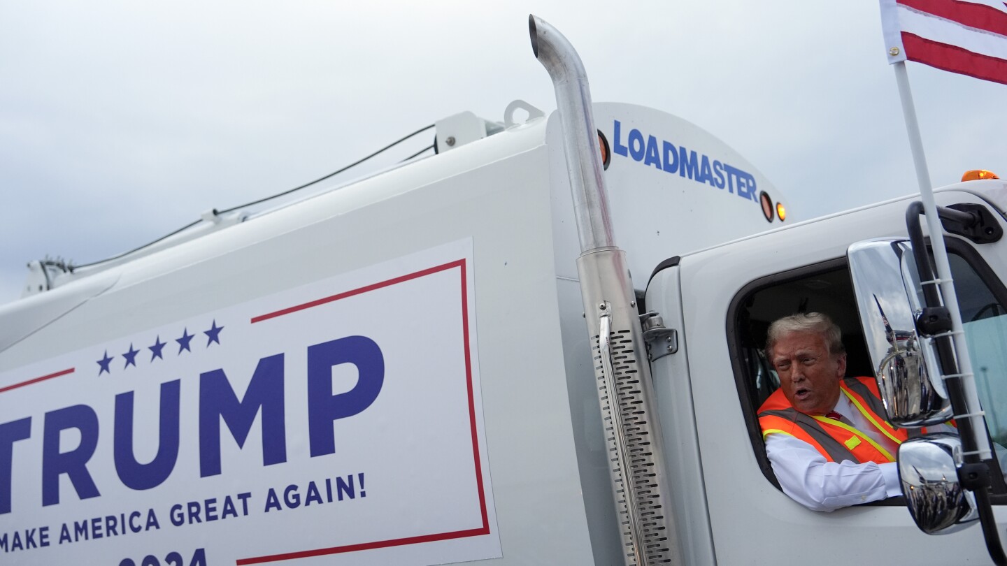 Trump boards a garbage truck to draw attention to Biden remark