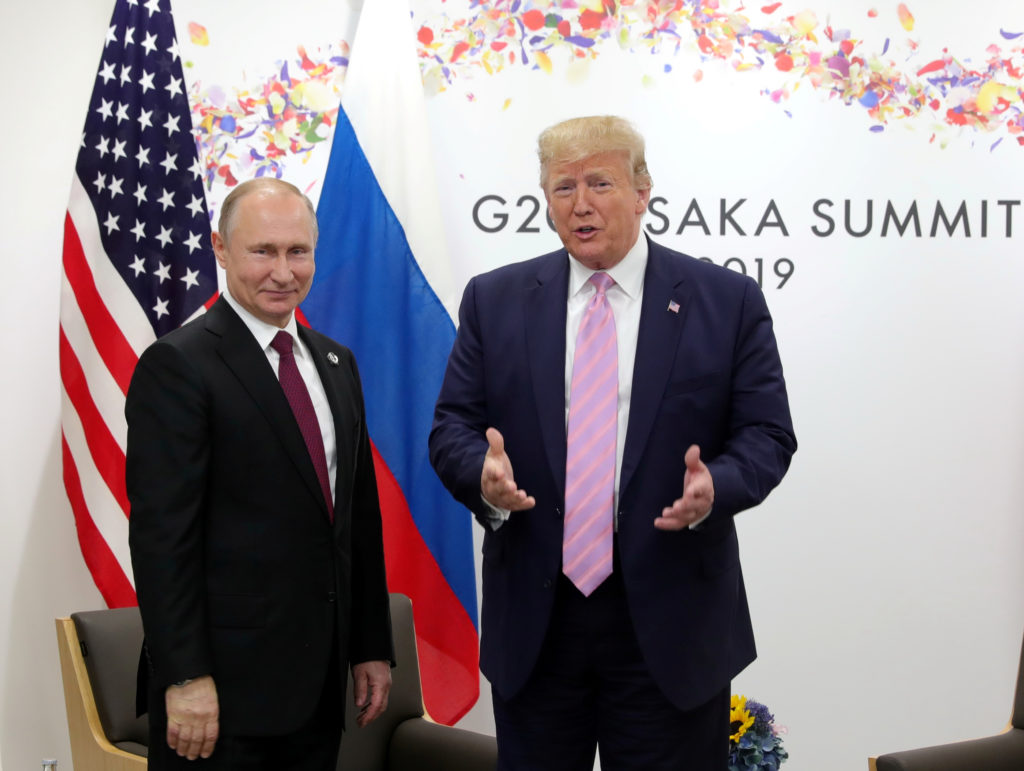 Russia's President Vladimir Putin and U.S. President Donald Trump attend a meeting on the sidelines of the G20 summit in O...