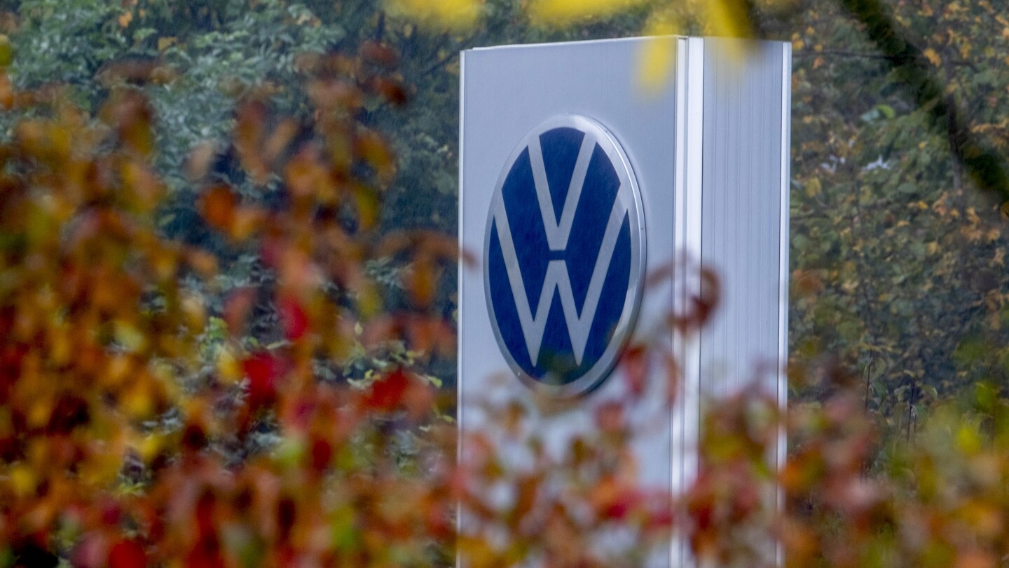 Volkswagen says cost cuts are urgently needed as its earnings decline sharply