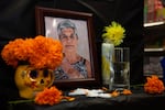 A photo of Marta Salinas, grandmother to Colima Market store owner, Yamely Chavez Kennedy, sits on the top of the ofrenda inside Colima Market in Bend, Ore., on Oct. 30, 2024. Salinas' favorite flower was cempasúchil.