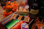 Sweets and a caguama of beer are on Yamley Chavez Kennedy's ofrenda at Colima Market in Bend, Ore. on Oct. 30, 2024. Her aunt loved beer, she said.