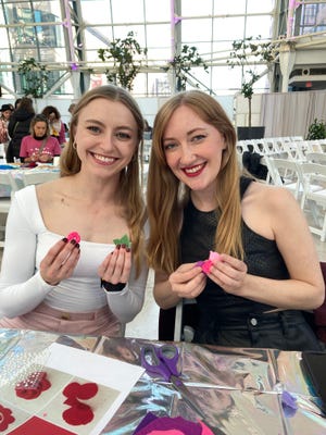 Catalina Graziano (left) and Halley Walsh participated in craft-making at the Indianapolis Artsgarden before attending Taylor Swift’s Nov. 1, 2024, Eras Tour show at Lucas Oil Stadium.