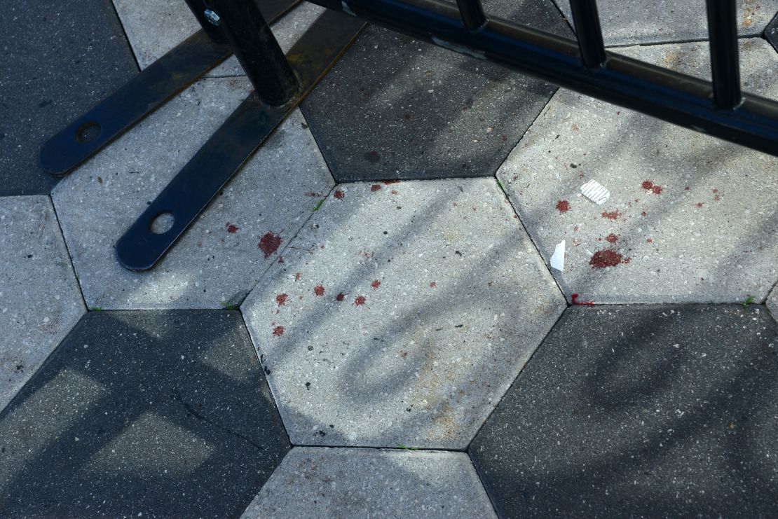 Bloodstains were seen on the sidewalk along Orange Ave., where a shooting occurred during Halloween festivities on November 01, 2024, in Orlando, Florida.