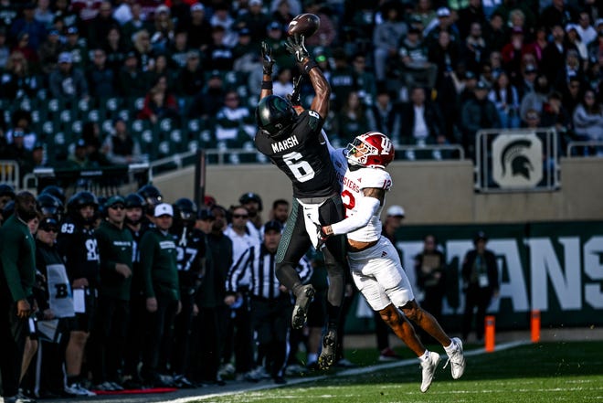 Michigan State's Nick Marsh, left, makes a catch as Indiana's Terry Jones Jr. defends during the first quarter on Saturday, Nov. 2, 2024, at Spartan Stadium in East Lansing.