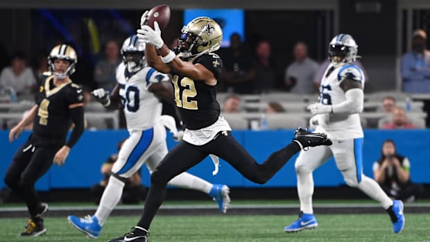 New Orleans Saints wide receiver Chris Olave (12) catches a deep ball against the Carolina Panthers 