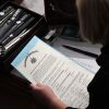 A person holds the certificate of electoral votes from Pennsylvania during a joint session of Congress early on Jan. 7, 2021, as the counting of electoral votes resumed after the riot at the U.S. Capitol.