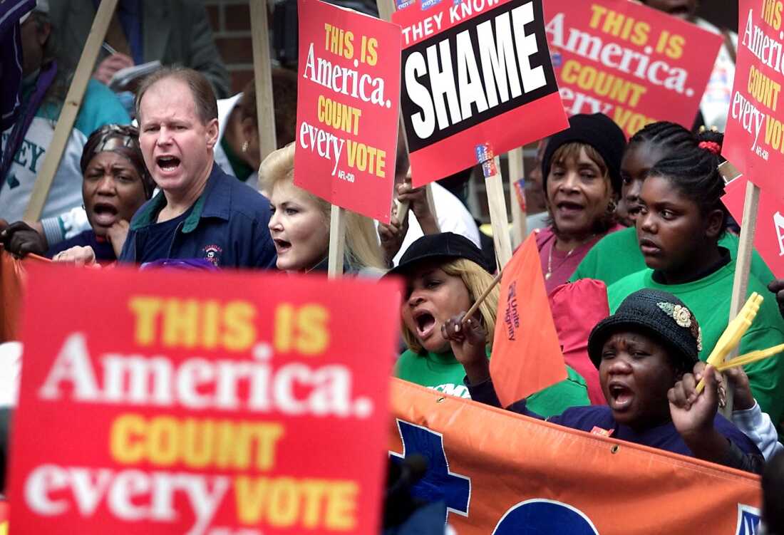 Dec. 13, 2000: Supporters of Democratic presidential candidate Al Gore march to the Florida State Capitol to rally against the legislature's intention to name a slate of electors favorable to Republican presidential candidate George W. Bush.