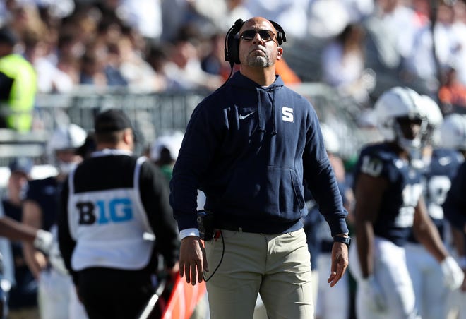 Nov 2, 2024; University Park, Pennsylvania, USA; Penn State Nittany Lions head coach James Franklin looks up at the scoreboard during the second quarter against the Ohio State Buckeyes at Beaver Stadium. Mandatory Credit: Matthew O'Haren-Imagn Images